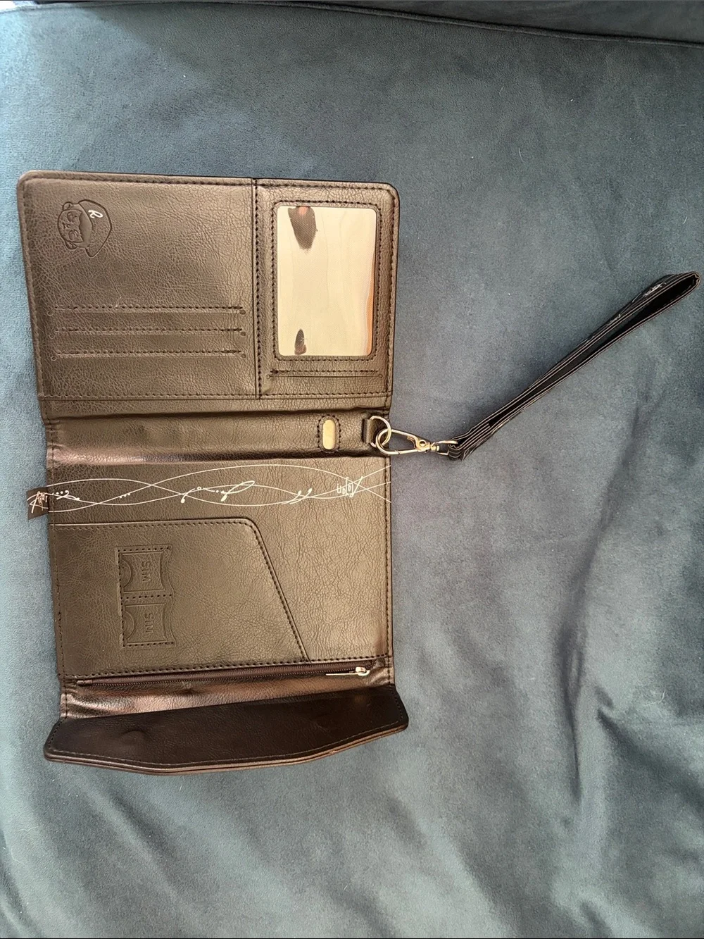 TNT RAyan Black Embossed Leather Passport Wallet with Signature Logo - Picture 8 of 10